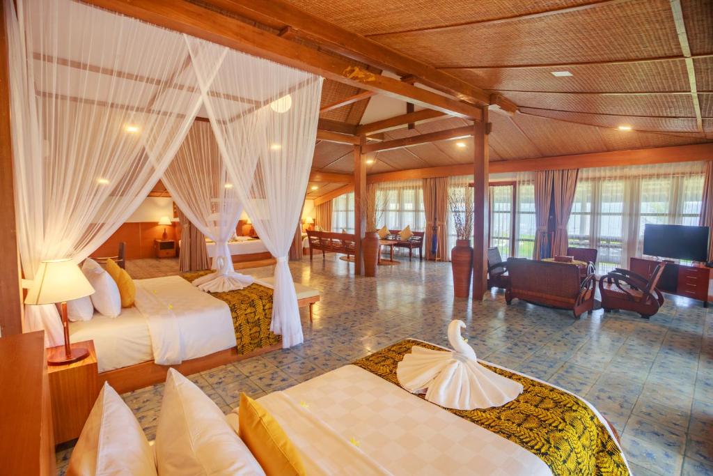 Postel nebo postele na pokoji v ubytování Villa So Long Banyuwangi - Ijen