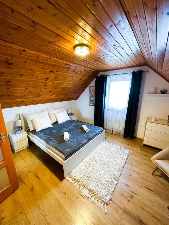 Postel nebo postele na pokoji v ubytování Panoráma Csopak