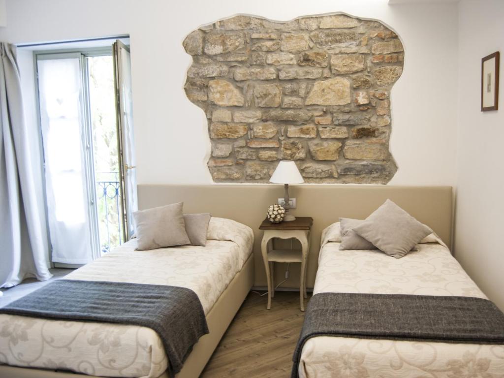 Postel nebo postele na pokoji v ubytování Al San Lorenzo
