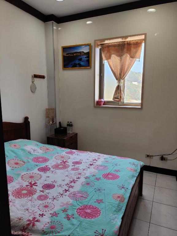Letto o letti in una camera di 芹壁溫馨海景民宿