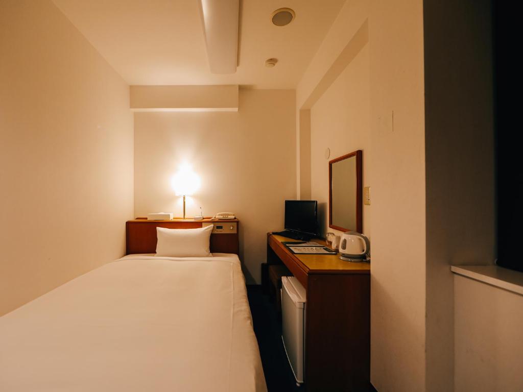 Postel nebo postele na pokoji v ubytování 3s HOTEL HIRATSUKA