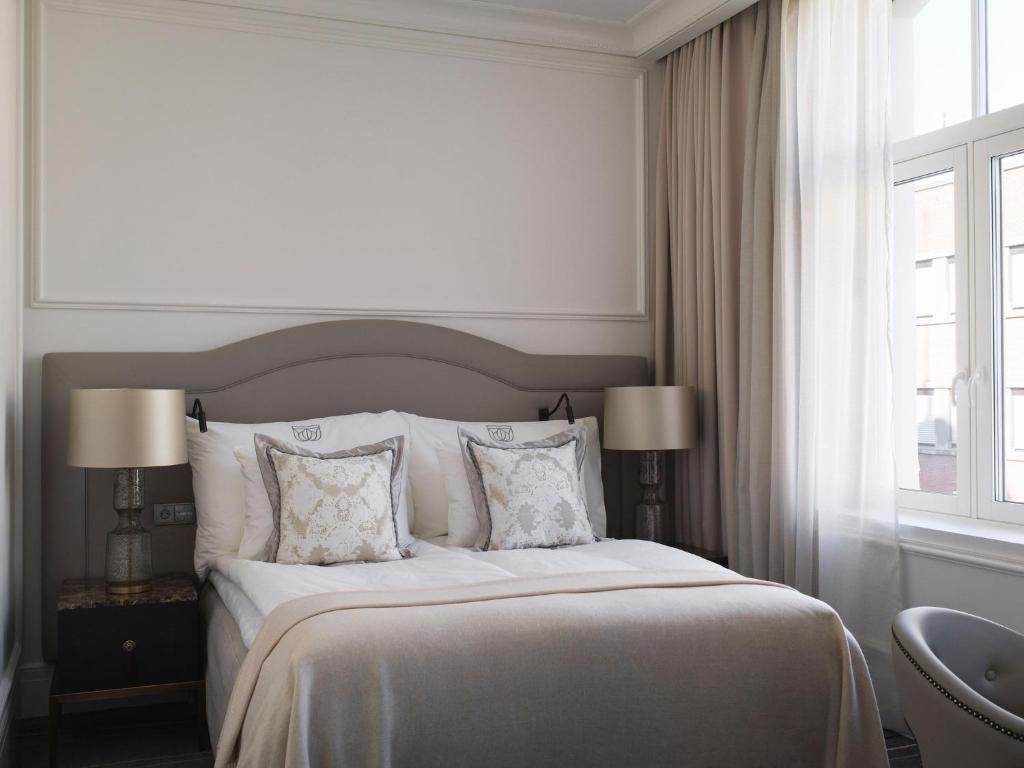 Postel nebo postele na pokoji v ubytování Britannia Hotel