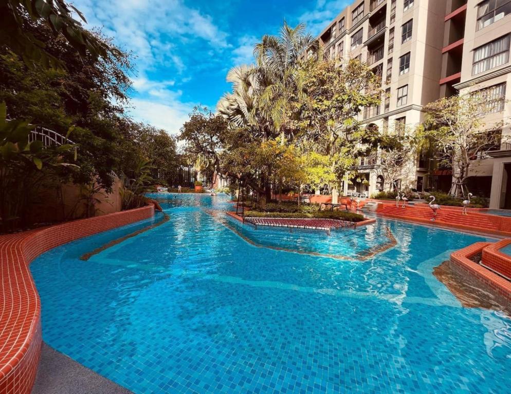 a large blue swimming pool in a city at La Habana Hua Hin by Wilmot-200 m from the beach in Khao Tao
