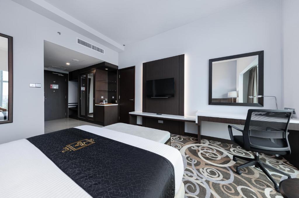 Postel nebo postele na pokoji v ubytování Raia Hotel & Convention Centre Kuching