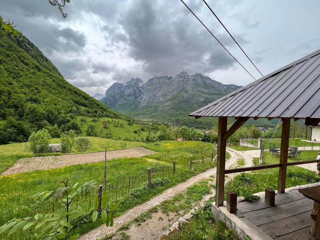 a house with a view of a mountain at Nature Guesthouse Vuthaj in Vusanje