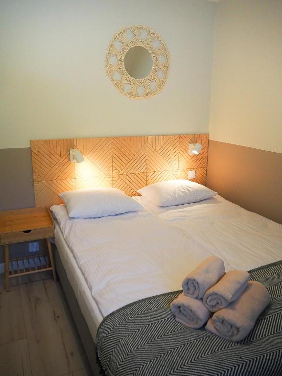 Postel nebo postele na pokoji v ubytování Ruchome Piaski