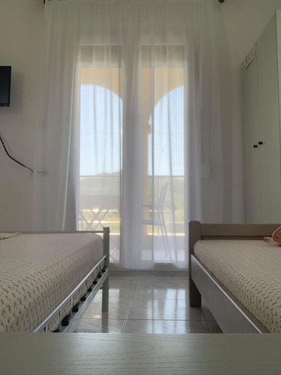 Postel nebo postele na pokoji v ubytování Nikolaidis House