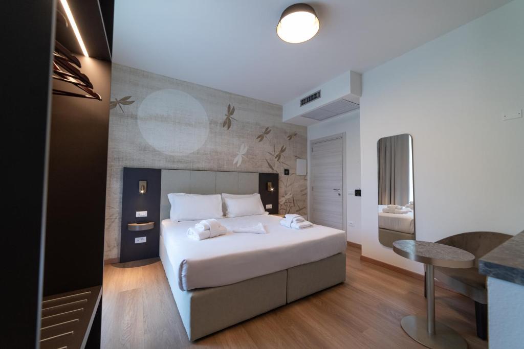 Postel nebo postele na pokoji v ubytování Hotel Arilica