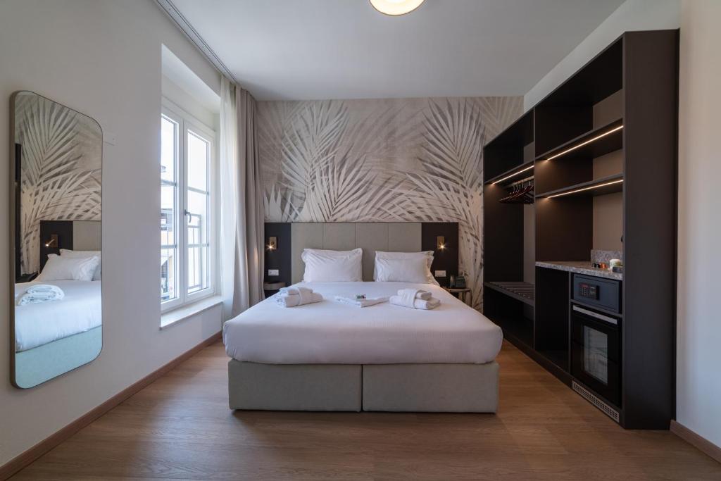 Postel nebo postele na pokoji v ubytování Hotel Arilica