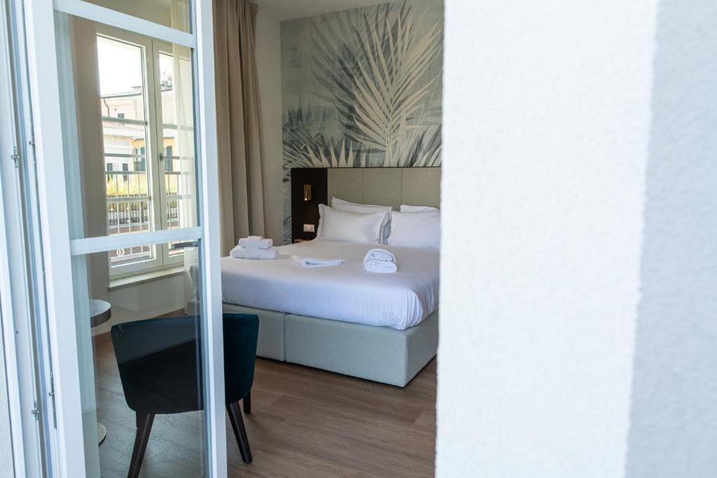 Postel nebo postele na pokoji v ubytování Hotel Arilica