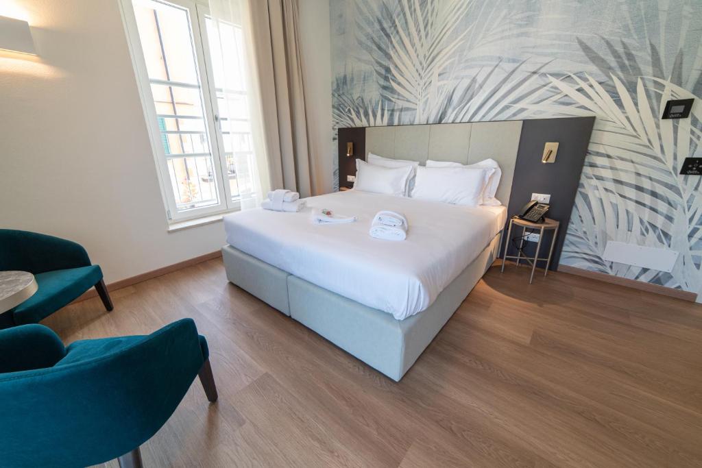 Postel nebo postele na pokoji v ubytování Hotel Arilica