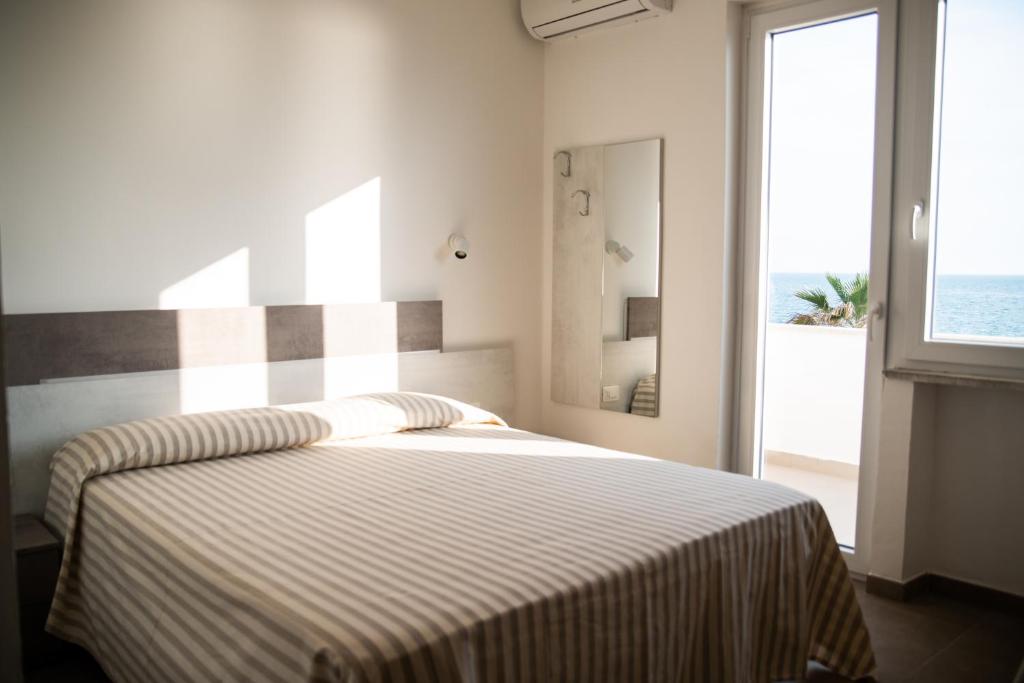 Postel nebo postele na pokoji v ubytování Blu Hotel
