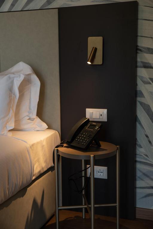 Postel nebo postele na pokoji v ubytování Hotel Arilica