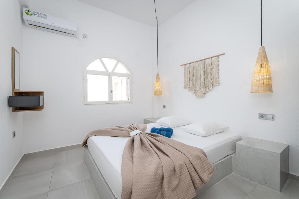 Postel nebo postele na pokoji v ubytování Golden View Villas