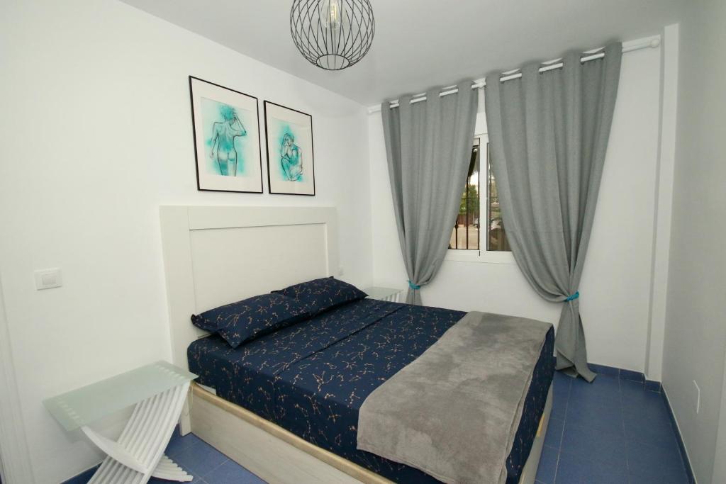 Postel nebo postele na pokoji v ubytování Xposure beach apartment