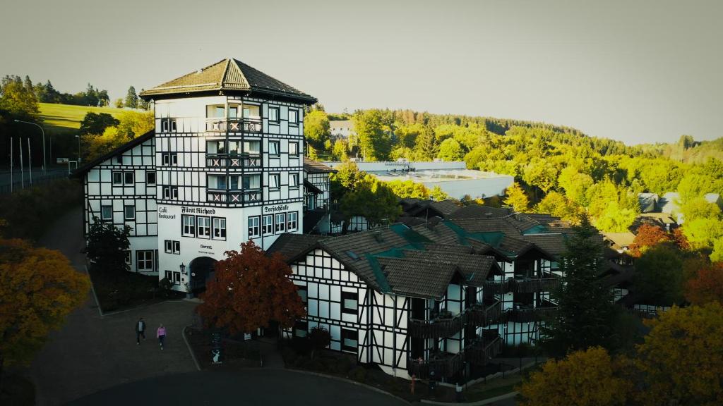 an aerial view of a large building with trees at Dorint Resort Winterberg in Winterberg