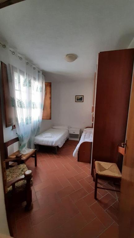 Postel nebo postele na pokoji v ubytování Residence San Francesco
