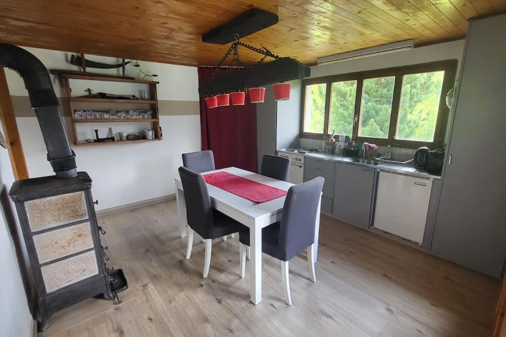 a kitchen and dining room with a table and chairs at Butterfly in Saint-Martin