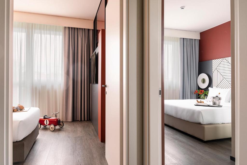 Uma cama ou camas num quarto em Quark Hotel Milano