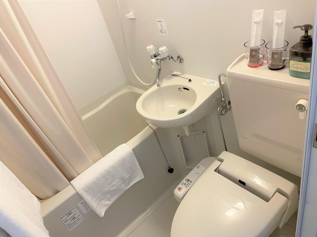 Koupelna v ubytování Karin doo Hotel