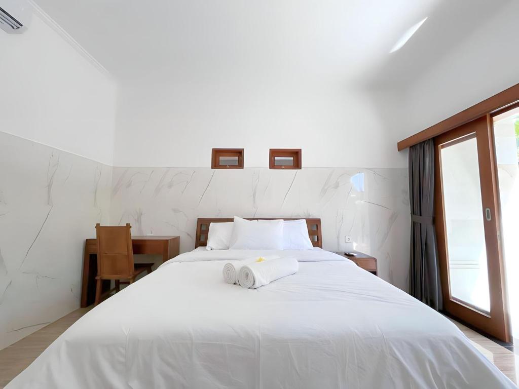 Kubu19 Guest House房間的床