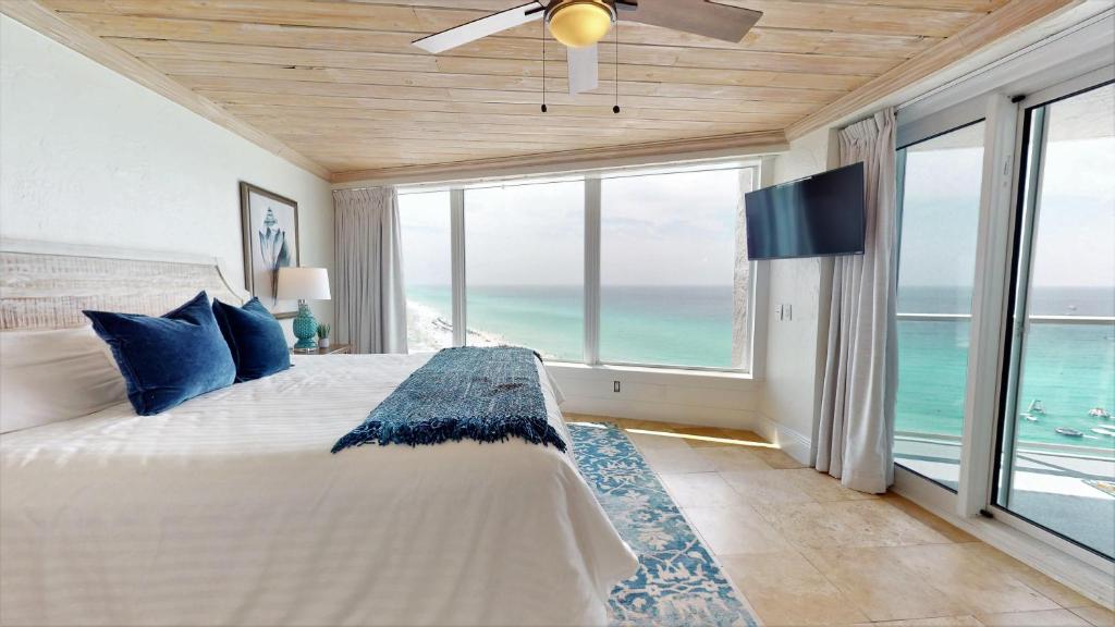 a bedroom with a bed with a view of the ocean at Beachside II 4367 in Destin