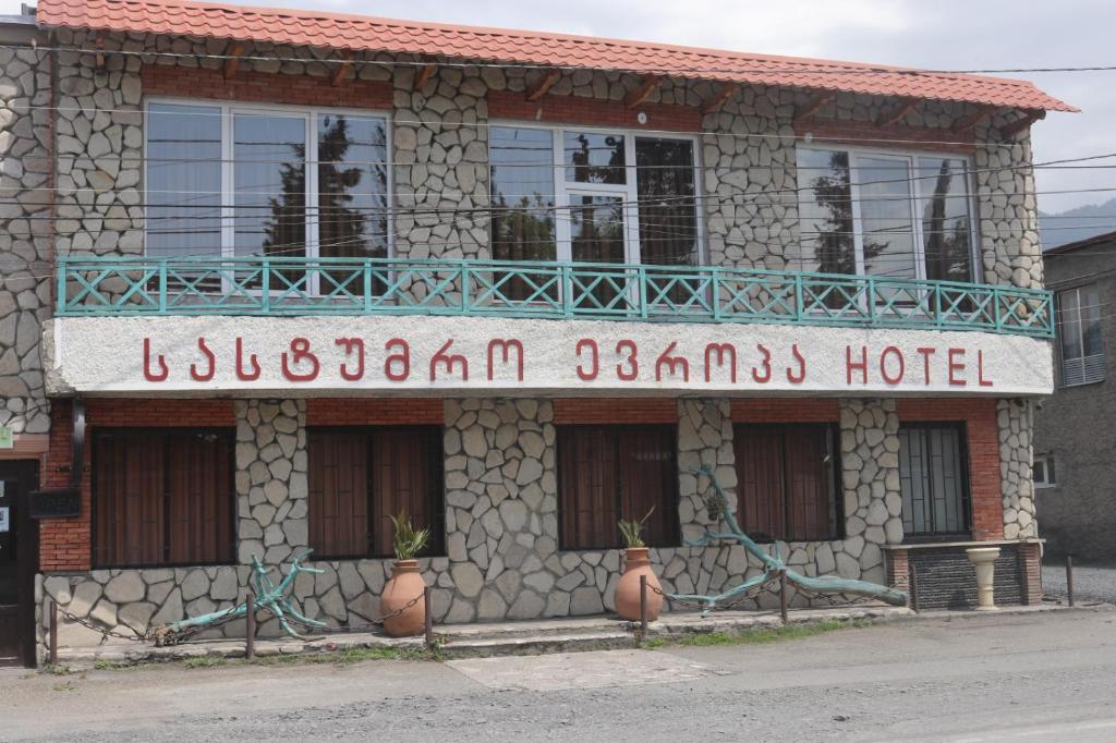 a building with a sign for a hotel at Hotel E U R O P E in Kvareli