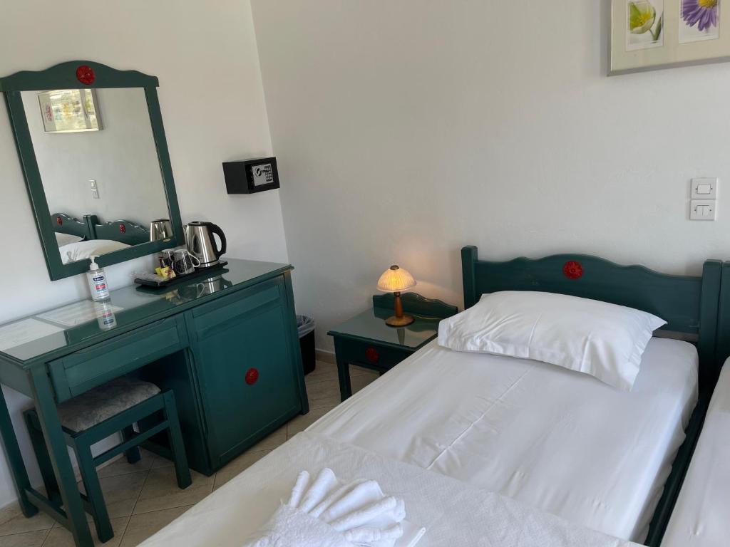 Postel nebo postele na pokoji v ubytování Venikouas Hotel
