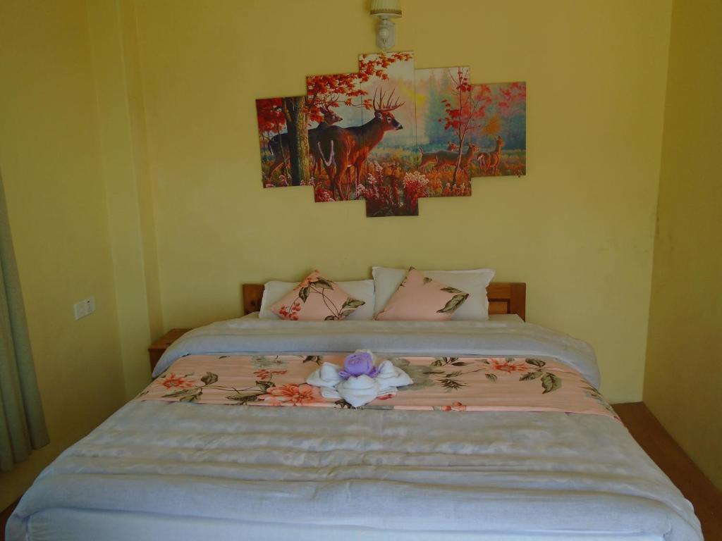 Rúm í herbergi á Hotel Sarangkot
