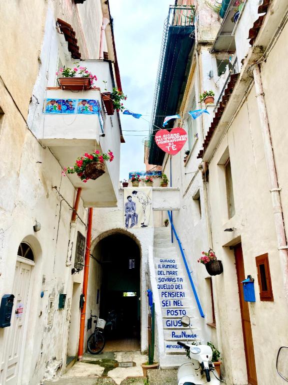 an alley with a stop sign in the middle at Il Riccio Apartment 28 in Procida