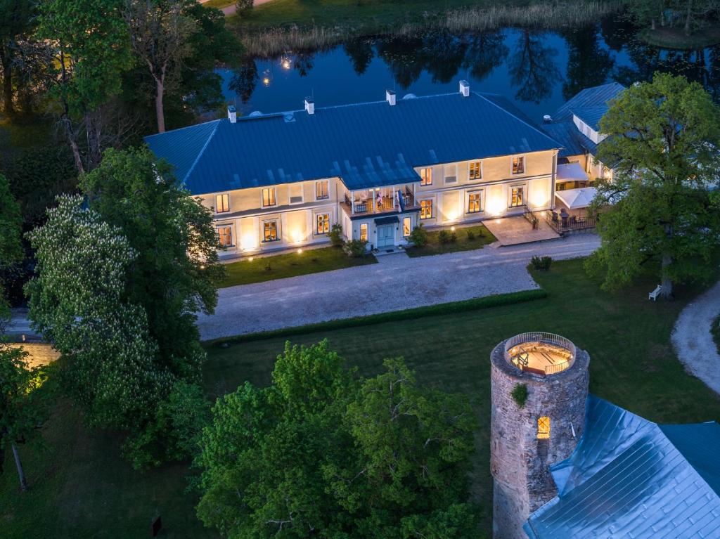 an aerial view of a mansion at night at Padise Manor & Spa Boutique hotel - Adults Only in Padise