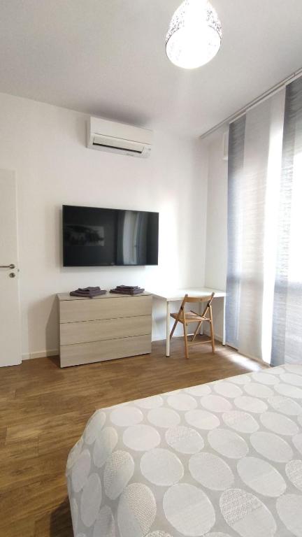 Televízia a/alebo spoločenská miestnosť v ubytovaní Santa Viola House