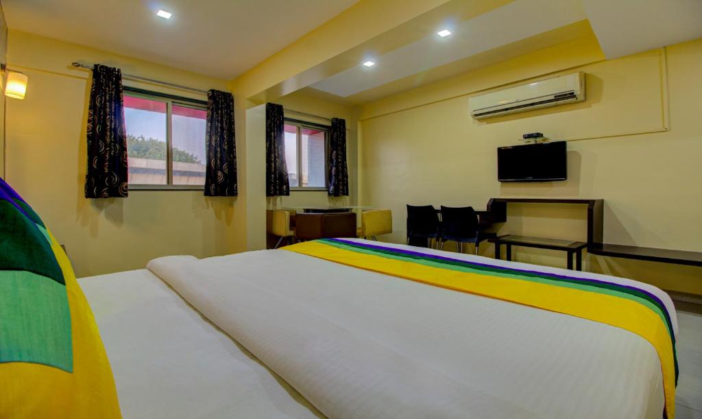TV a/nebo společenská místnost v ubytování Itsy Hotels Prince Regency