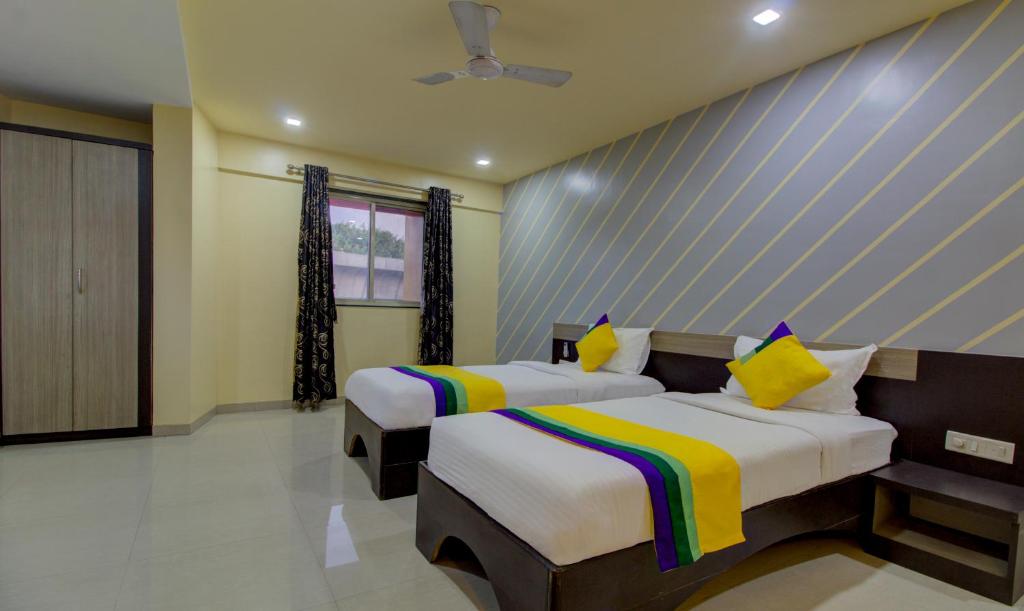 Postel nebo postele na pokoji v ubytování Itsy Hotels Prince Regency