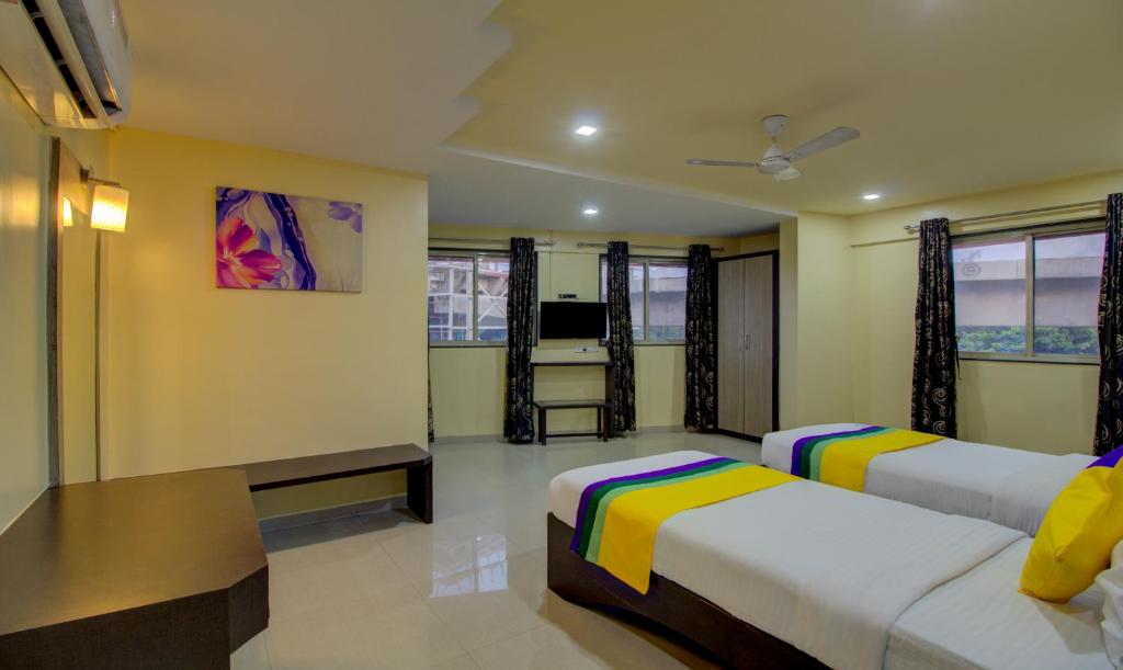 Postel nebo postele na pokoji v ubytování Itsy Hotels Prince Regency
