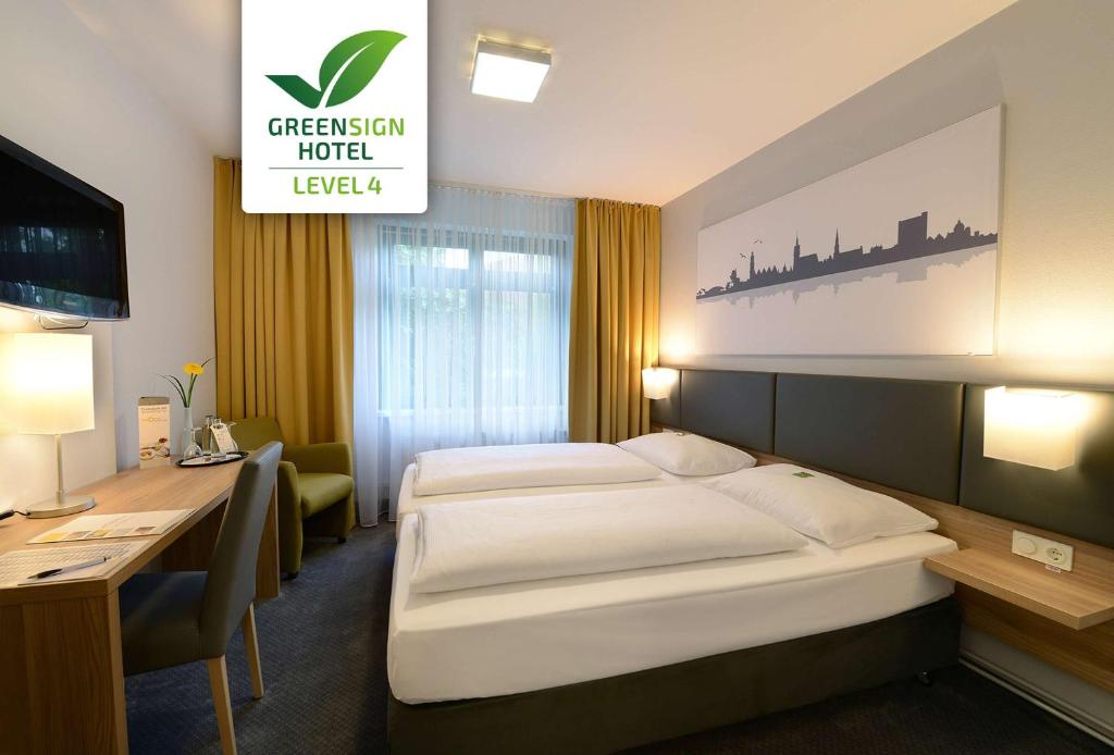 Postel nebo postele na pokoji v ubytování GHOTEL hotel & living Hannover