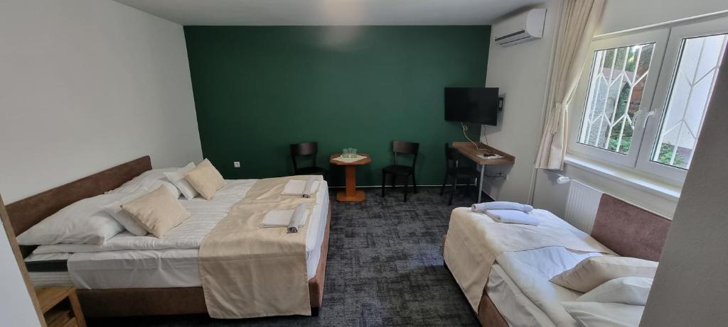 Postel nebo postele na pokoji v ubytování A Fogadó