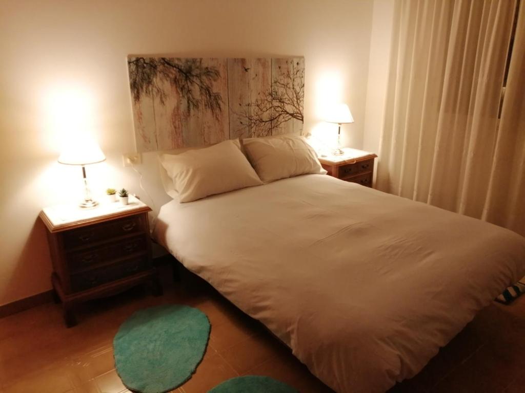 Postel nebo postele na pokoji v ubytování A CASA DOS AVÓS