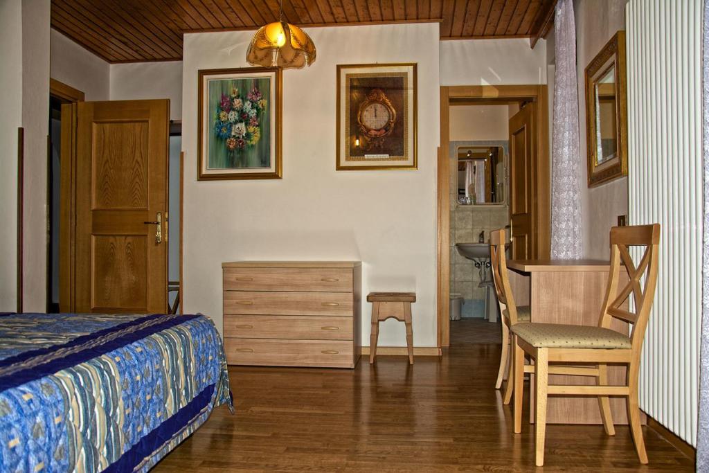 Postel nebo postele na pokoji v ubytování Albergo Ristorante Iris
