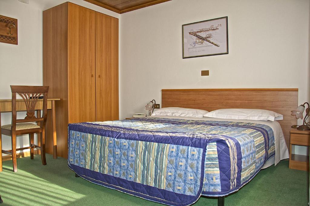 Postel nebo postele na pokoji v ubytování Albergo Ristorante Iris