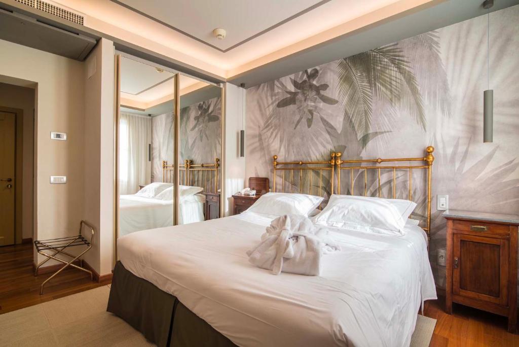 Posteľ alebo postele v izbe v ubytovaní Terme Preistoriche Resort & Spa