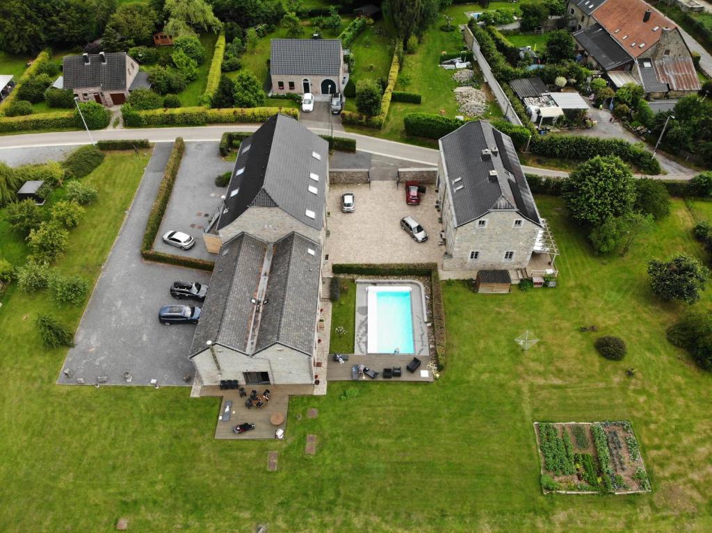 an aerial view of a large house with a yard at Couleur Campagne in Theux