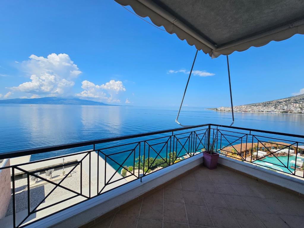a balcony with a view of the water at Amazing Sea View Apartment in Sarandë