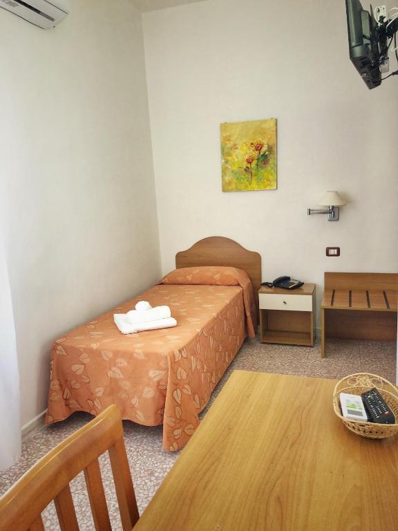Postel nebo postele na pokoji v ubytování Hotel Pineta