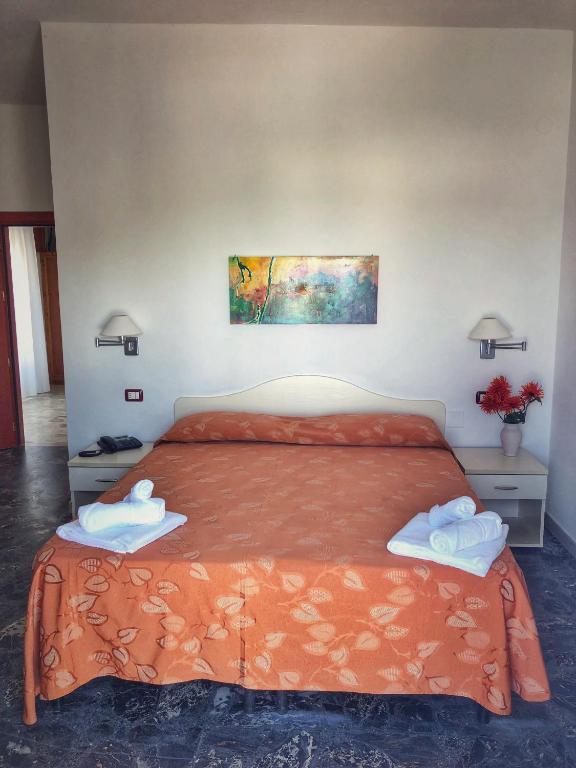 Postel nebo postele na pokoji v ubytování Hotel Pineta