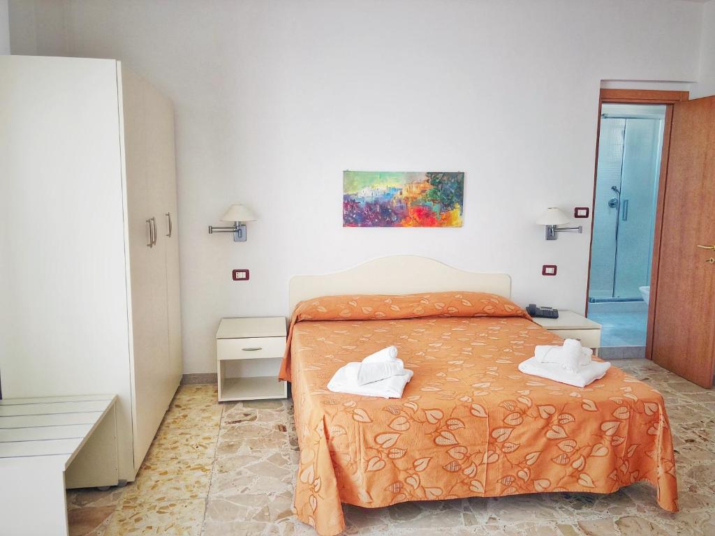 Postel nebo postele na pokoji v ubytování Hotel Pineta