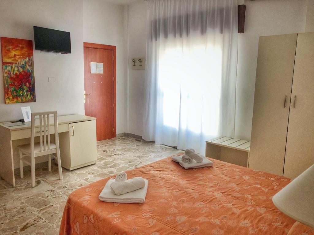Postel nebo postele na pokoji v ubytování Hotel Pineta