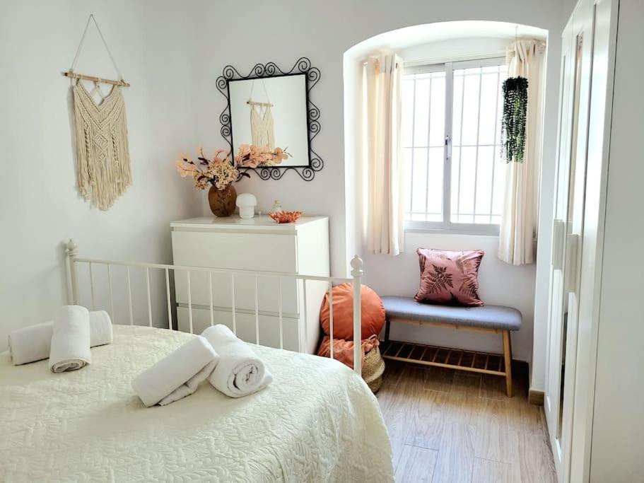 Ένα ή περισσότερα κρεβάτια σε δωμάτιο στο Casa Dionisio - Súper central y tranquilo con terraza y parking