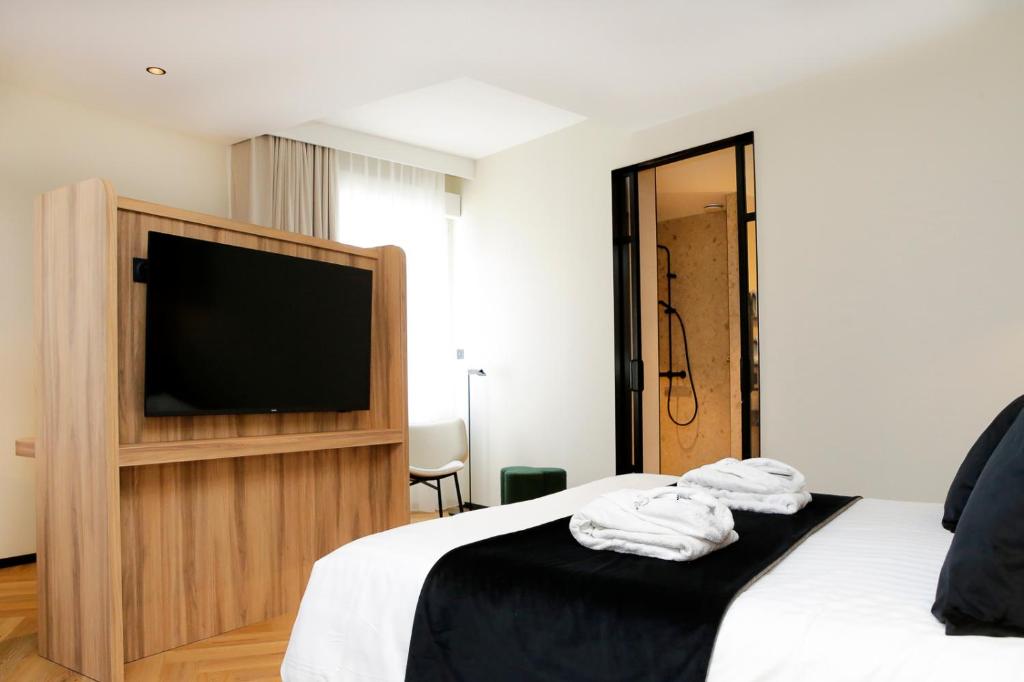 Postel nebo postele na pokoji v ubytování Le Richebourg Hôtel, Restaurant & Spa