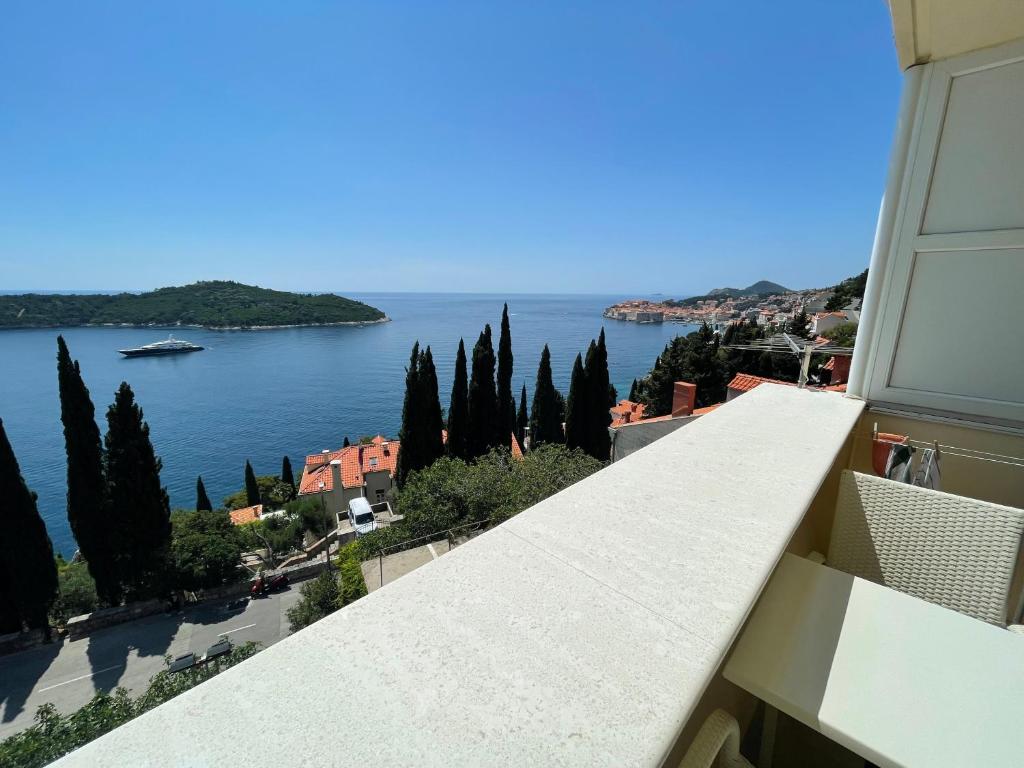 a view of the water from a balcony at Deluxe Sunset Room, view of the Old Town in Dubrovnik